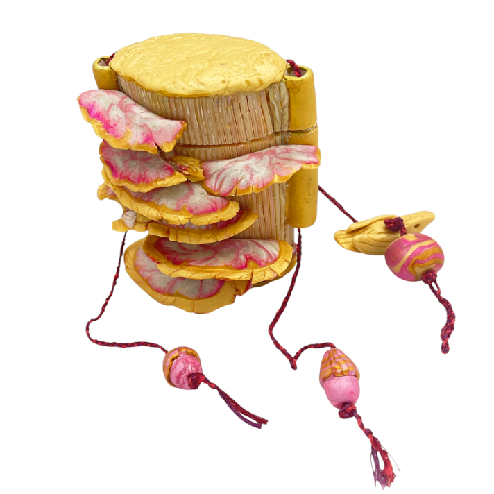 I was inspired by the inro form of the previous piece and its use of faux wood grain in polymer clay.