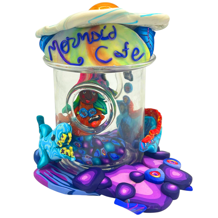 Mermaid Cafe: "The image of a fried egg came into my head after seeing the mermaid coming out of an egg. Then I thought of using a lightbulb for the yoke. I continued with the mermaid and underwater theme to make a "swim up" window in the underwater cafe with an egg as a roof."